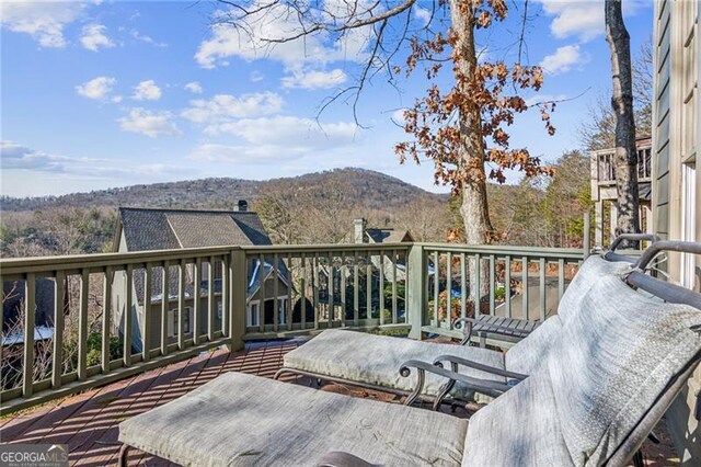 wooden terrace with a mountain view