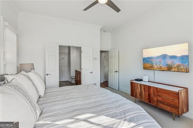 carpeted bedroom with ceiling fan and ornamental molding