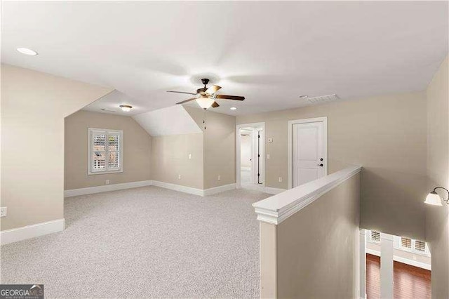 bonus room featuring ceiling fan, lofted ceiling, and carpet floors