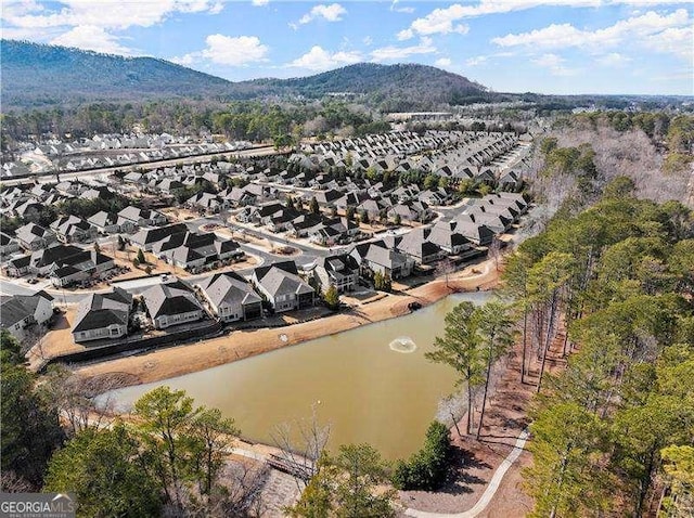 bird's eye view featuring a water and mountain view