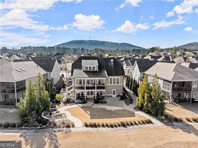 back of property with a mountain view