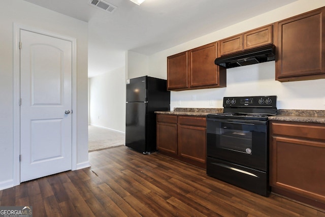 kitchen with dark wood-type flooring and black appliances