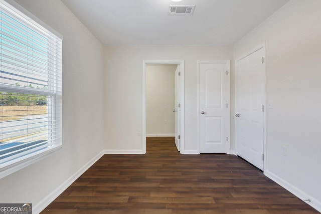 unfurnished room featuring dark hardwood / wood-style floors