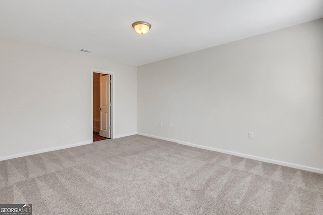 unfurnished room featuring carpet floors