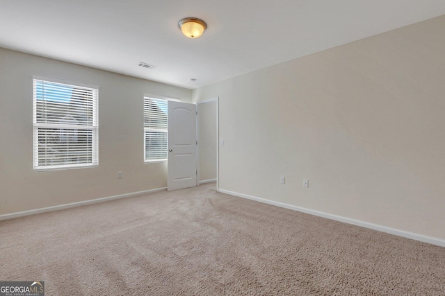 unfurnished room with carpet floors