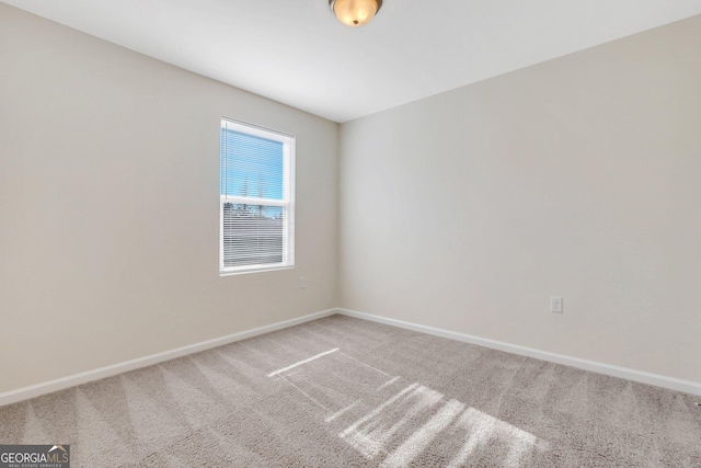 unfurnished room featuring carpet flooring