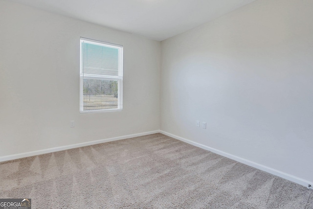 unfurnished room featuring carpet