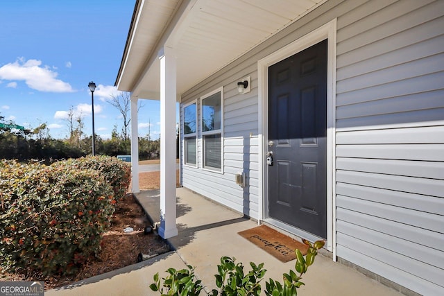 doorway to property featuring a porch