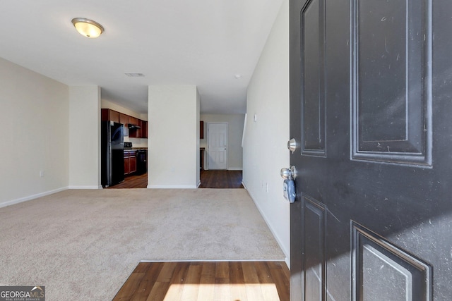 view of carpeted entrance foyer