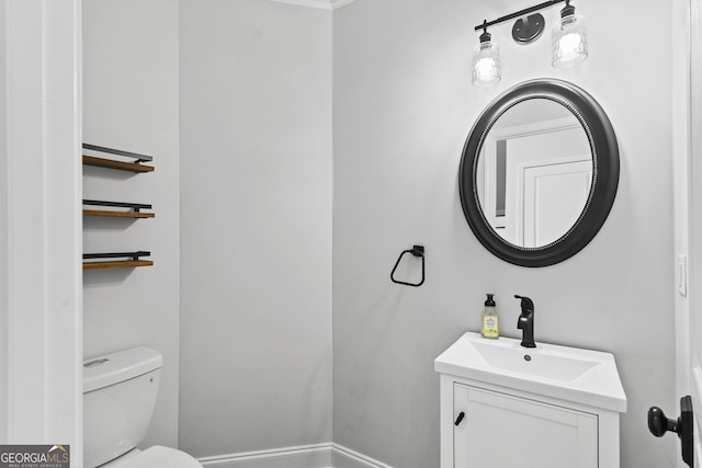 bathroom with toilet and vanity