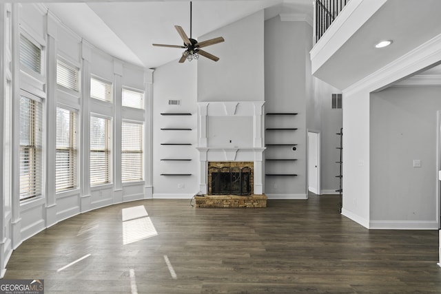 unfurnished living room with ceiling fan, dark wood-type flooring, high vaulted ceiling, and a fireplace