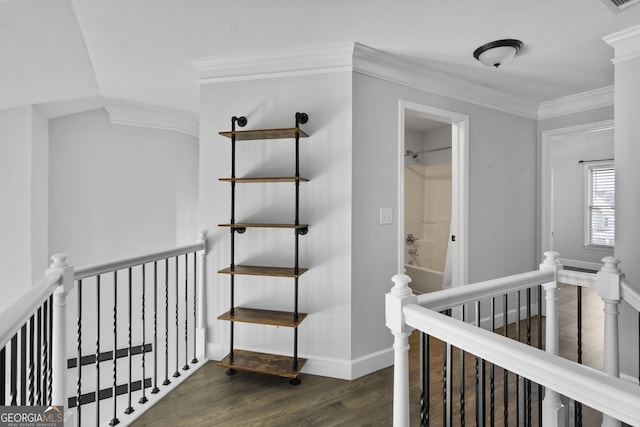 hall with dark hardwood / wood-style flooring and ornamental molding