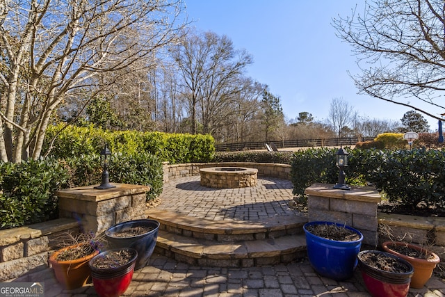 view of patio / terrace featuring a fire pit