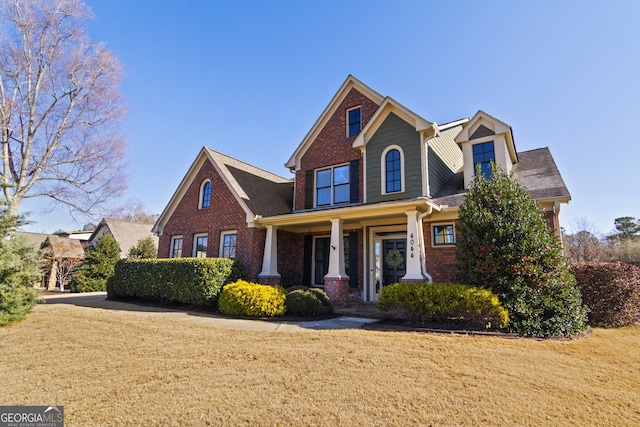 view of front of house featuring a front lawn and a porch