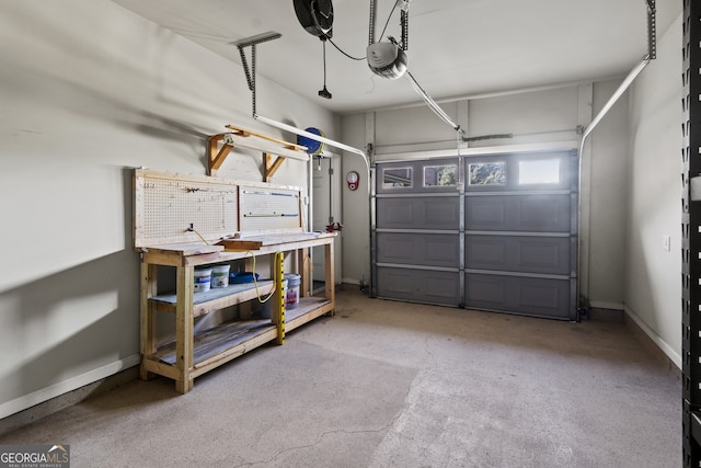 garage featuring a workshop area and a garage door opener