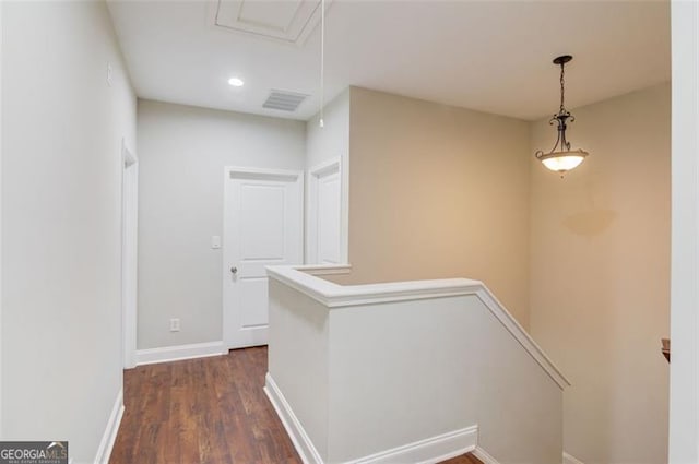 corridor with dark hardwood / wood-style floors