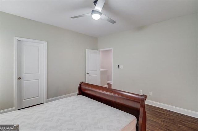 bedroom with ceiling fan and dark hardwood / wood-style floors