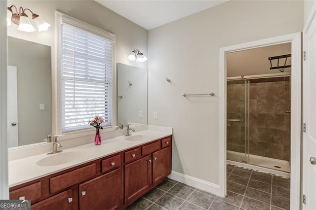 bathroom with tile patterned flooring, walk in shower, and vanity