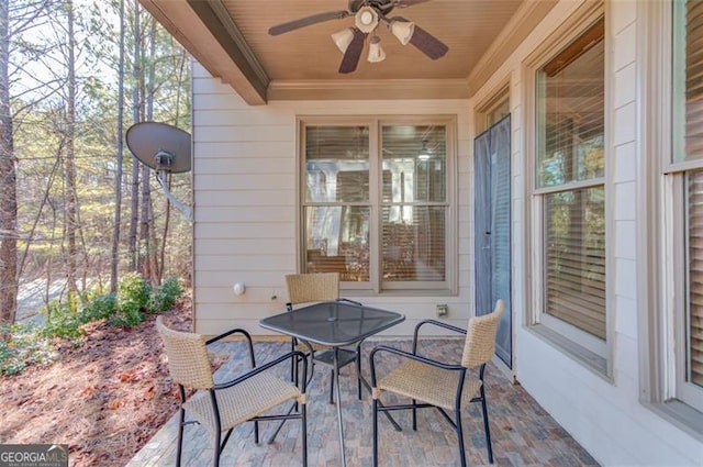 view of patio featuring ceiling fan