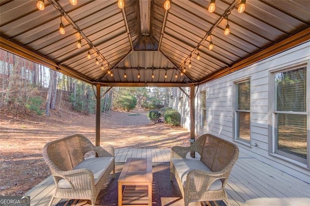 deck featuring a gazebo and an outdoor living space