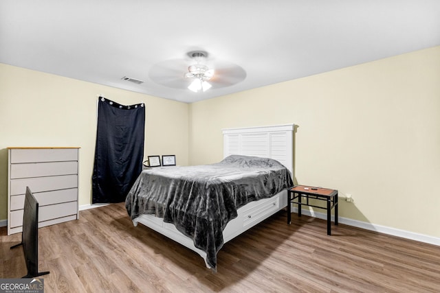 bedroom featuring ceiling fan and hardwood / wood-style flooring