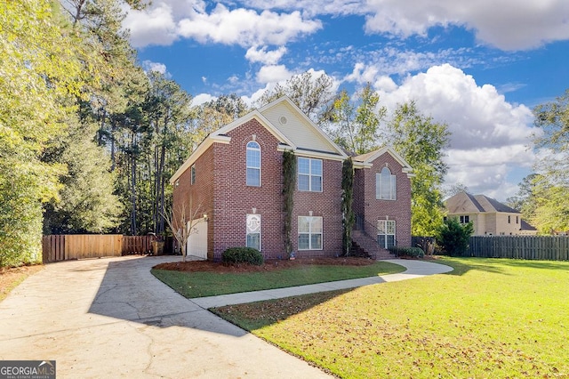 view of front of home with a front lawn and a garage