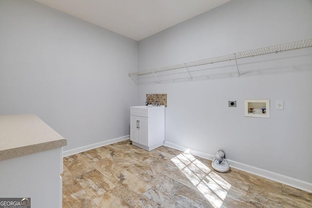 washroom featuring washer hookup, electric dryer hookup, and cabinets