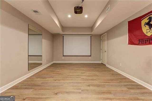 home theater room featuring light wood-type flooring