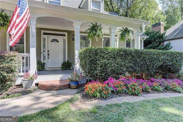 property entrance featuring covered porch