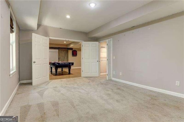 carpeted empty room with pool table