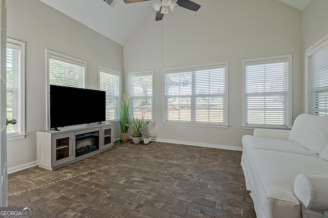 living room with ceiling fan and lofted ceiling