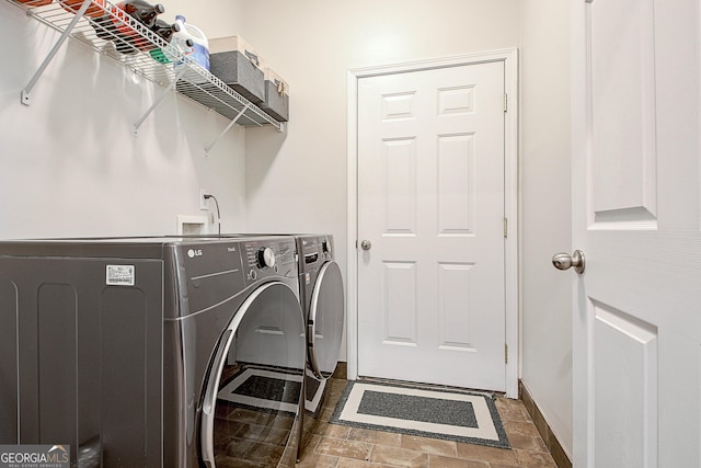 laundry room featuring washing machine and dryer