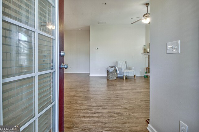 corridor featuring wood-type flooring