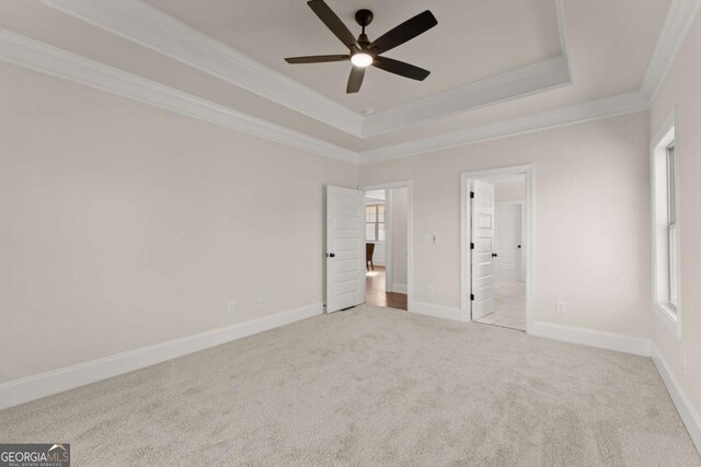 5721 Brickhampton Ct, Clermont, GA 30527 - unfurnished bedroom with crown molding, carpet floors, a raised ceiling, ensuite bathroom, and a ceiling fan