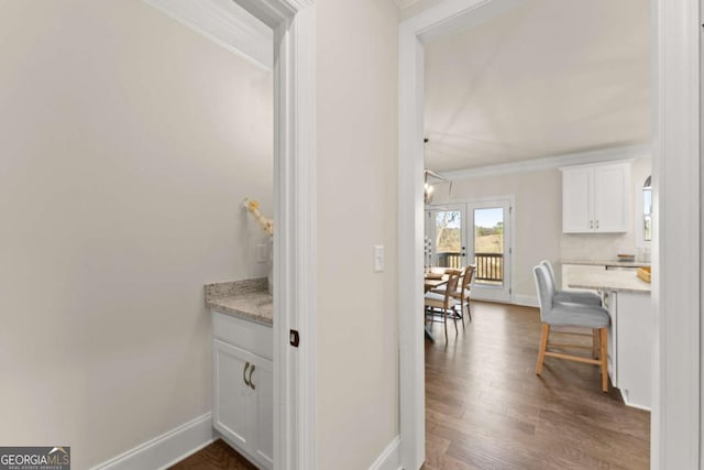 5721 Brickhampton Ct, Clermont, GA 30527 - corridor featuring dark wood finished floors, ornamental molding, and baseboards