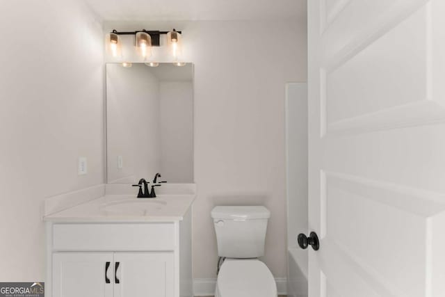 bathroom with toilet and vanity