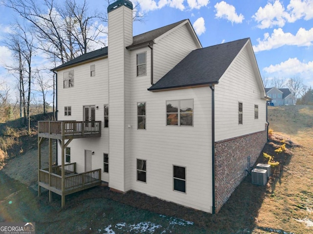 5721 Brickhampton Ct, Clermont, GA 30527 - back of property with a chimney, central air condition unit, brick siding, a wooden deck, and a balcony