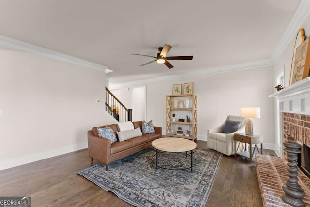 5721 Brickhampton Ct, Clermont, GA 30527 - living area with a ceiling fan, a fireplace, crown molding, wood finished floors, and stairs