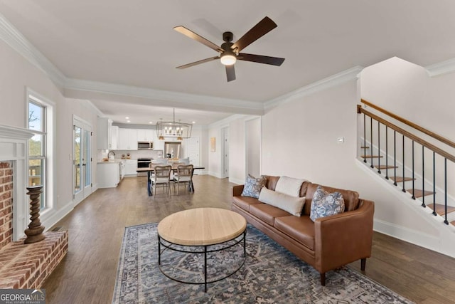 5721 Brickhampton Ct, Clermont, GA 30527 - living room with wood finished floors, ornamental molding, ceiling fan, and baseboards