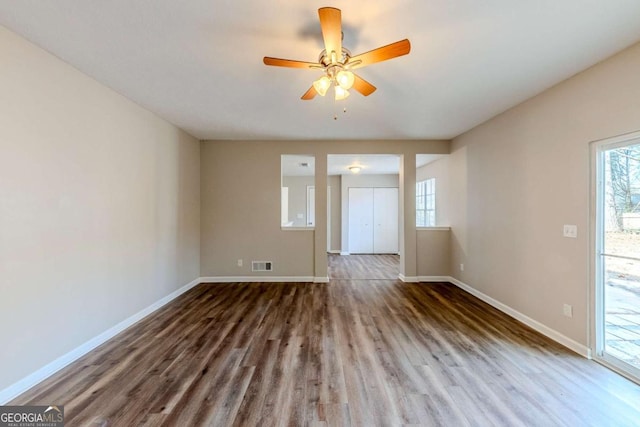 unfurnished room featuring ceiling fan and wood-type flooring