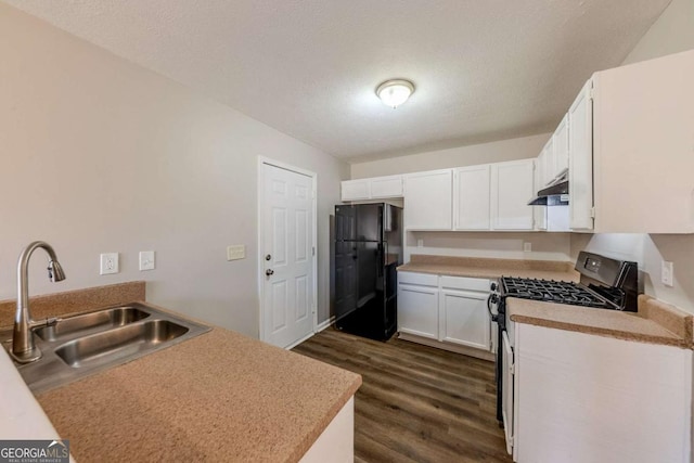 kitchen with a textured ceiling, white cabinets, black appliances, sink, and dark hardwood / wood-style floors