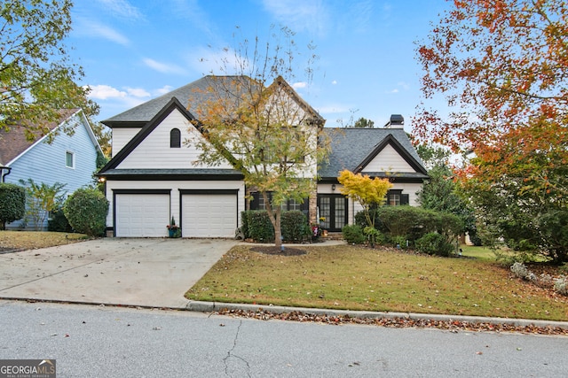 view of front facade featuring a garage and a front lawn