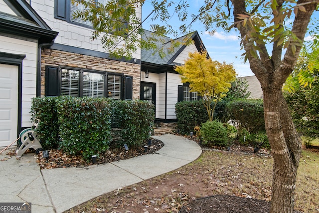 doorway to property featuring a garage