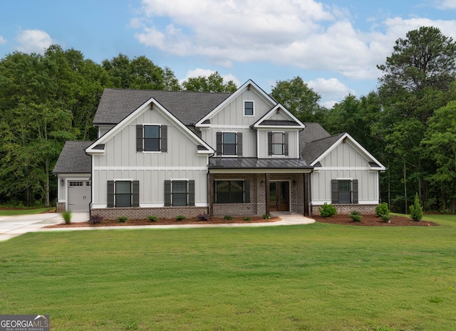 view of front of house featuring a garage and a front lawn