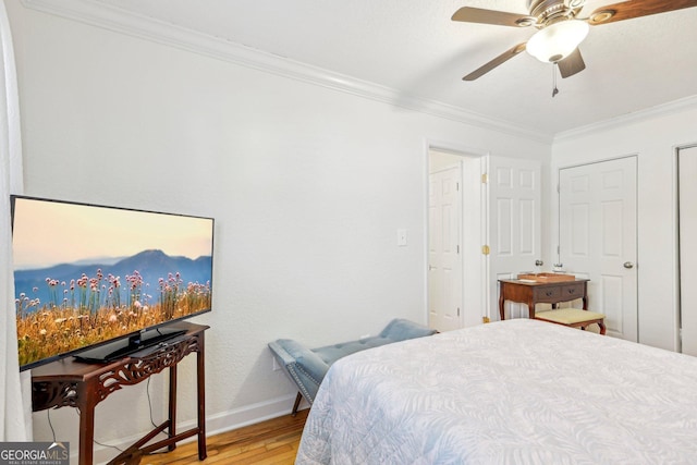 885 Briarcliff Rd NE Unit 21, Atlanta, GA 30306 - bedroom featuring crown molding, light wood finished floors, baseboards, and ceiling fan