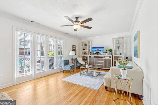 885 Briarcliff Rd NE Unit 21, Atlanta, GA 30306 - living area featuring a ceiling fan, ornamental molding, and wood finished floors