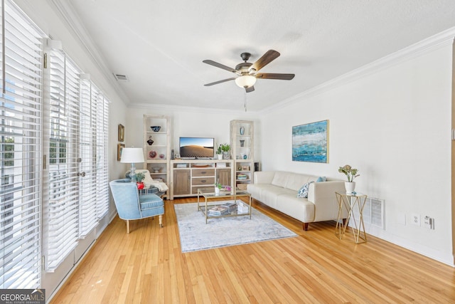 885 Briarcliff Rd NE Unit 21, Atlanta, GA 30306 - living room with light wood-type flooring, a ceiling fan, crown molding, and built in features