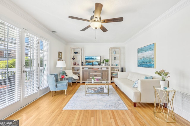 885 Briarcliff Rd NE Unit 21, Atlanta, GA 30306 - living room with wood finished floors, a ceiling fan, and ornamental molding