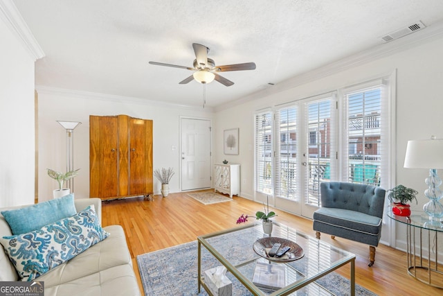 885 Briarcliff Rd NE Unit 21, Atlanta, GA 30306 - living room featuring wood finished floors, ceiling fan, ornamental molding, and baseboards