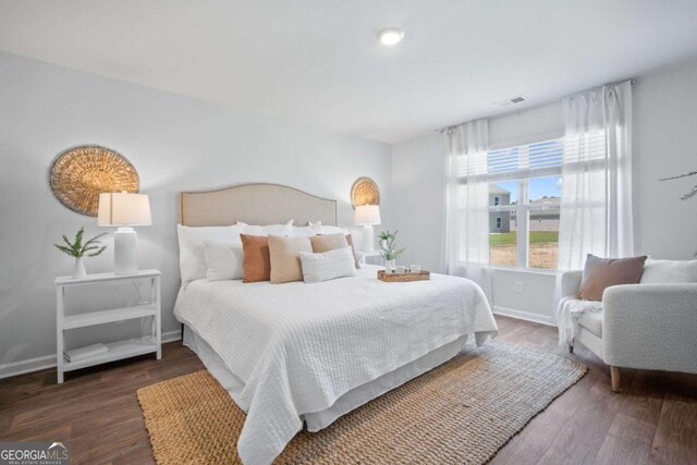 bedroom featuring dark wood-type flooring